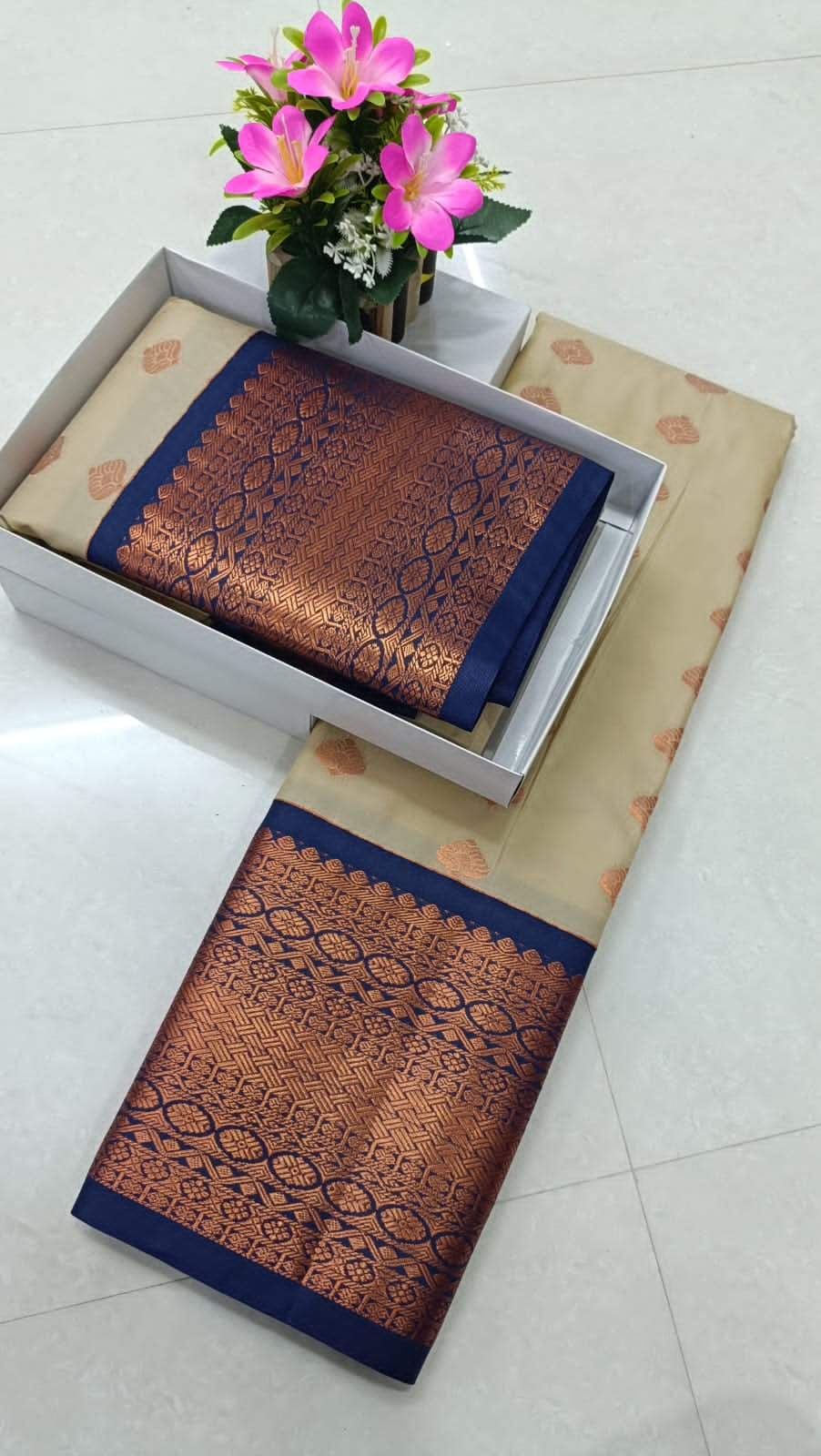 Cream and navy blue semi silk pattu saree